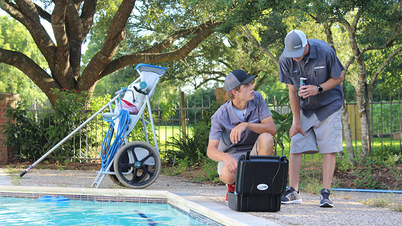 The Pool Boys on site at a Customer's pool checking water chemistry